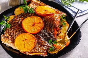Карп с апельсинами в духовке